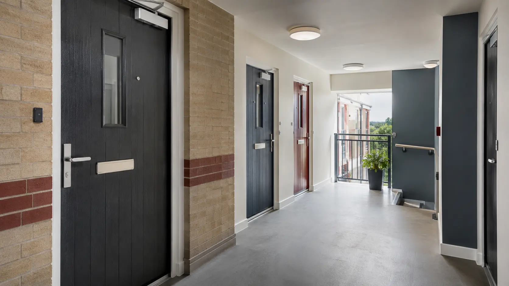 Composite flat-entrance fire doors in a UK residential block